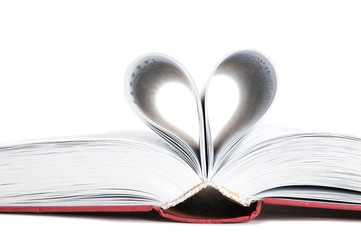 pages of a book curved into a heart shape