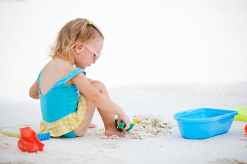 Little girl playing at beach