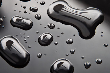 Water drops with umbrella shape on black background - obrazy, fototapety, plakaty