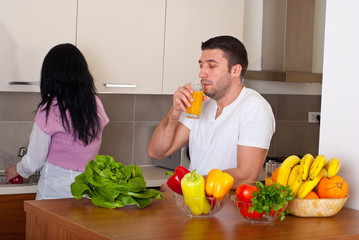 Mid adult couple in kitchen
