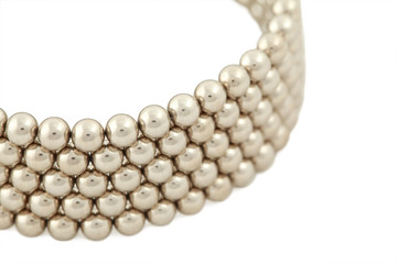 Part of bangle from beads near-by on  white background