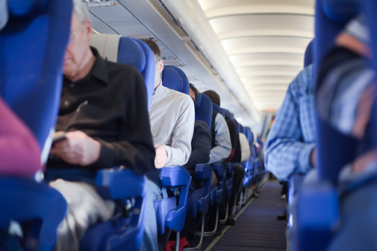 Aisle Between The Seats In The Airplane Cabin