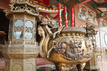 Fototapeta premium Chinese dragon incense burner in front of Chinese temple.