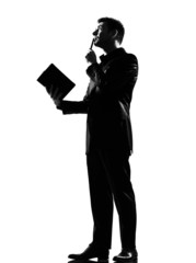 silhouette  man with note pad pensive thinking
