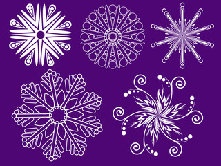 many different white snowflakes on a purple background