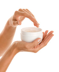 Close up of woman's hands with body lotion