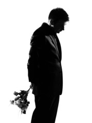 silhouette  man offering flowers