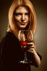 woman with red hair holding wine glass