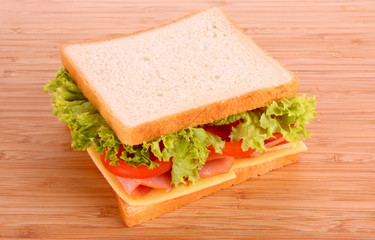 Sandwich on wooden plate