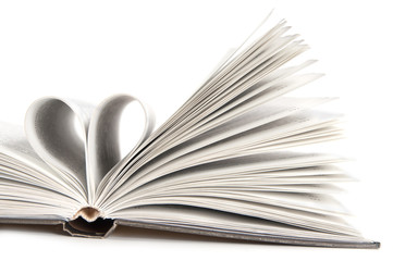 pages of a book curved into a heart shape