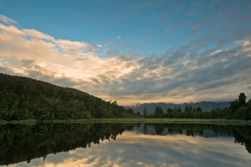 Sunrise above a lake on a wind still morning