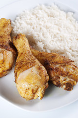 Roasted chicken legs with boiled rice