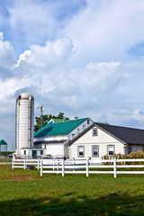 Fototapeta premium farm house with field and silo