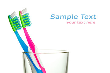 two toothbrushes in the glass with copy-space