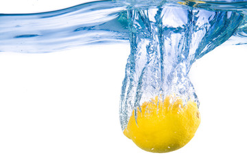 Lemon fell into the water. Close-up