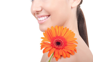 woman with flower on shoulder