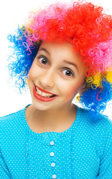 Young girl with colorful party wig