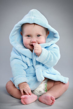 Charming Baby In A Blue Bathrobe