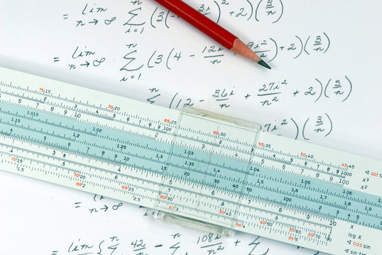 slide rule being used for calculation
