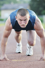 Obraz premium young athlete on start