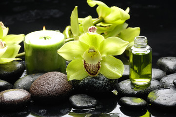 Oriental spa with orchid , candle and pebbles