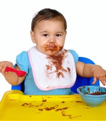 baby with messy chocolate pudding face