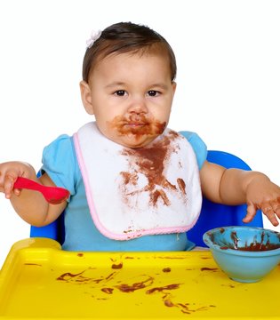 Baby With Messy Chocolate Pudding Face