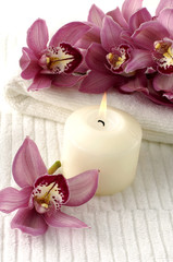 Spa composition (white towel and pink orchids on towel)