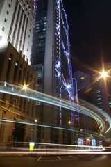 Fototapeta na wymiar Traffic through downtown of Hong Kong with high rise buildings