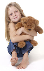 Girl with teddy bear with a happy expression