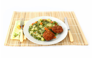 Vegetable dish with fork and knife