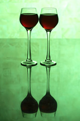 Glasses on green background