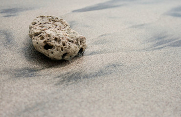 Coral rock in volcanic sand
