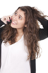 woman speaking on the phone and holding her hair