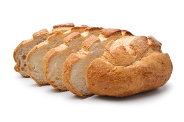 Traditional homemade round bread, sliced, isolated on a white ba