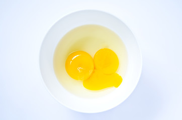 Raw egg in the cup.