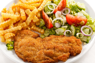 Pork chop, French fries and vegetables