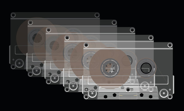 Compact cassettes on a black background.