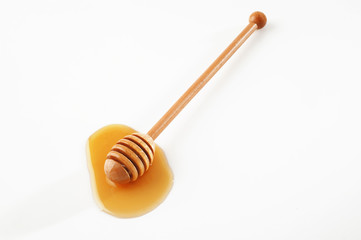 honey with wood stick