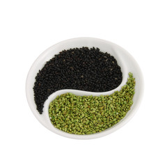 Flavored sesame seeds in small yin yang shape plate