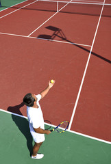 young man play tennis outdoor