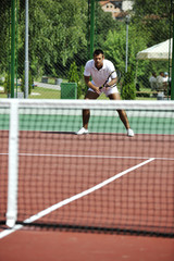 young man play tennis outdoor