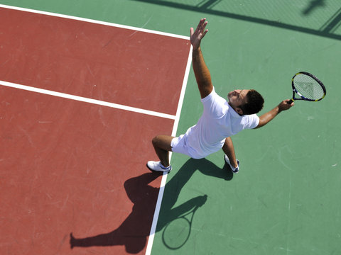 young man play tennis outdoor