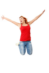Young happy caucasian woman jumping in the air
