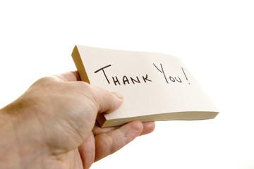 Hand giving a thank you note