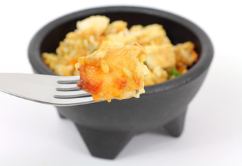 Chicken fried rice on fork