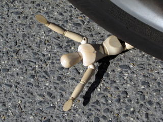 Accident, puppet under the wheel