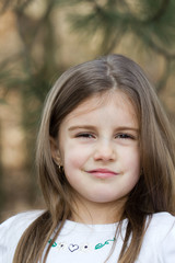 Fototapeta premium Portrait of smiling girl outdoor