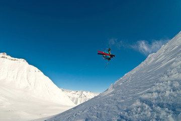 Naklejka na ściany i meble Skier flying in the air