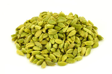 Cardamom pods in heap on white background